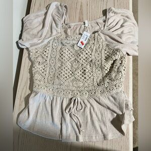 Short sleeve cream color shirt from Maurice’s -brand new never worn.